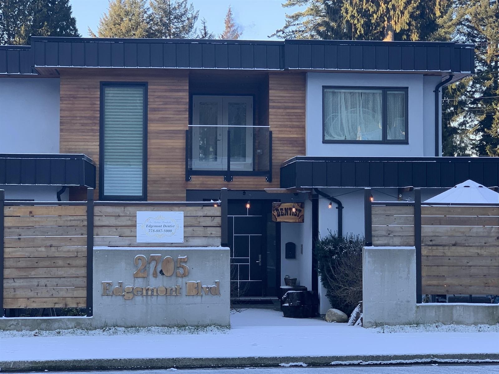 Edgemont Dentist at 2705 Edgemont Blvd, North Vancouver, seen from the street, with the address set into the wall