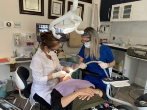 Dr. Farshchi working on a patient at the Edgemont Dentist Dental Clinic